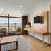 Ramada by Wyndham Bursa Cekirge Thermal & Spa room with balcony, seating area, and bedroom in Bursa