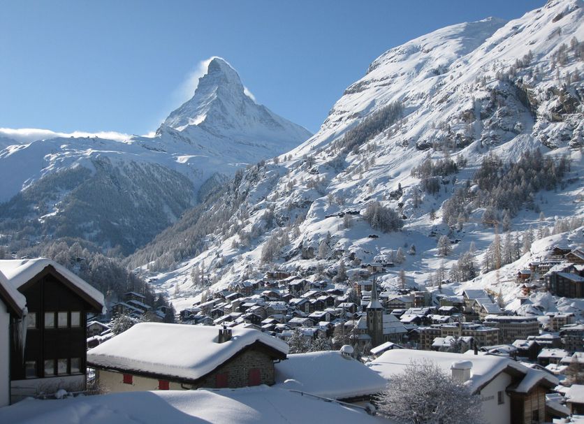 Basecamp Hotel in Zermatt with snowy mountain peaks and alpine village views