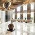 Langham Place Xiamen lobby with sculptural ceiling, marble floor, and modern seating