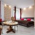 Royal Gdansk, Gdansk: guest room with double bed, seating area, large windows and stone accent wall