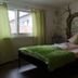 Hotel Dreikönig & Restaurant Seegourmet guest room in Hagnau am Bodensee with wrought-iron bed and green accents