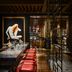 Rosewood Guangzhou in Guangzhou, chic dining room with red bar stools and a framed art display