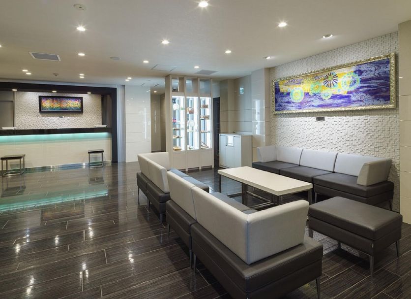 Jr-East Hotel Mets Nagaoka lobby lounge with seating and reception desk in Nagaoka