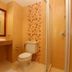 Baan Klang Hua Hin bathroom with toilet, sink, mirror and glass shower in Hua Hin