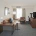 Residence Inn by Marriott Colorado Springs North/Air Force Academy suite with sofa, desk and king bed