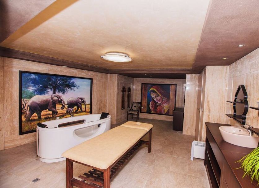 Aqua View Spa Boutique Hotel in Golden Sands spa treatment room with massage table and sink