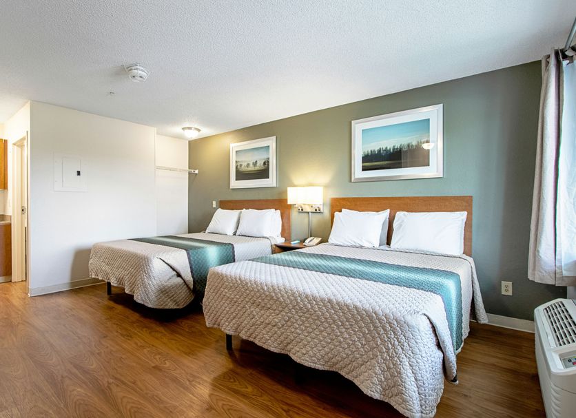 HomeTowne Studios by Red Roof Denver - Lakewood West guest room with two beds and window