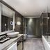 Mercure Istanbul Bomonti bathroom with walk-in shower, bathtub and vessel sink