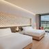 Landing Jeju Shinhwa World Hotels & Resorts in Seogwipo, twin beds and balcony with resort view