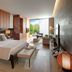 Mandarin Oriental, Bodrum guest room with king bed and balcony view of greenery