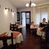 La Teresita Hotel Boutique in Salta dining room with tables set for guests and a few people seated by the window