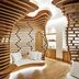 Nobu Hotel Marbella in Marbella, sculptural wooden lounge seating with curved slatted walls