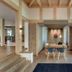 Hotel Strandhaus - Boutique Resort & Spa in Lübben, modern lounge with dining table and floor-to-ceiling windows