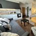The Churchill Court in Woodstock suite with kitchenette, sofa, armchair and round dining table