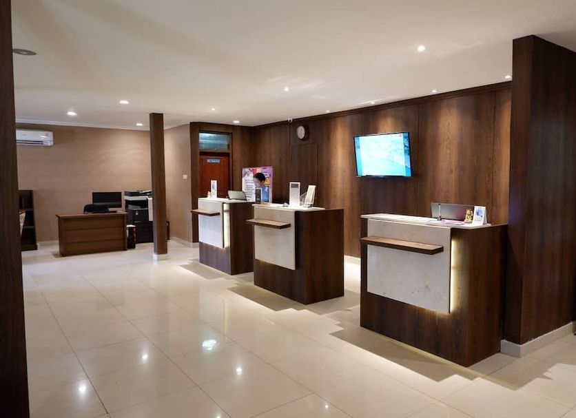 Sanghyang Indah Spa resort lobby reception area in Anyar with wooden check-in desks and tile floors