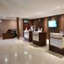Sanghyang Indah Spa resort lobby reception area in Anyar with wooden check-in desks and tile floors
