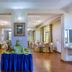 Kilimo Grand Resort Nairobi banquet hall with round dining tables and polished wood floors