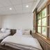 Guanwu Villa in Tai'an Township guest room with two twin beds and large windows with natural light