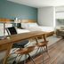 Element Austin Round Rock guest room with two beds, desk, sofa, and large window view in Round Rock