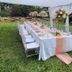 Hotel Troy Nairobi outdoor garden dining table under white canopy with floral centerpieces