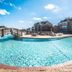 Barrier Island Station in Duck with a large outdoor pool, sun deck, and oceanfront buildings