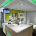 ibis budget Marseille Est Porte d'Aubagne reception desk with lime green accents in Marseille