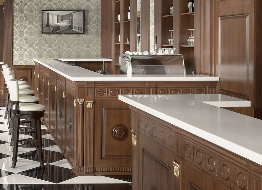 London Boutique Hotel bar with wood paneling, white countertops and black-and-white checkered floor in Chisinau