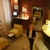 Hôtel Edmond Rostand Marseille lobby with armchairs, reception desk and floor-to-ceiling curtains