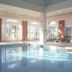 Holiday Inn Corby Kettering Hotel & Spa by IHG indoor pool with lounge chairs and large windows in Corby