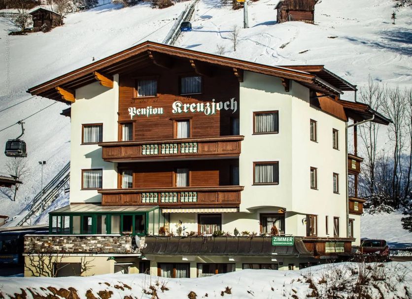 Pension Kreuzjoch in Zell am Ziller, 3-star chalet-style hotel on a snowy mountainside