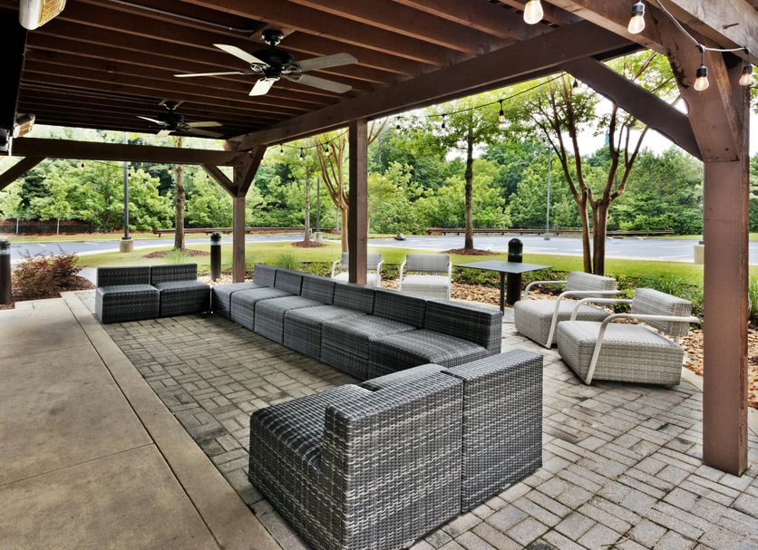 Hilton Garden Inn Birmingham SE/Liberty Park outdoor covered patio with seating and park views