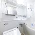 APA Villa Hotel Kyoto-Ekimae bathroom with bathtub, sink, mirror and handheld shower in Kyoto