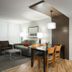 West Coast Suites At UBC Vancouver suite with kitchenette, dining table and sofa seating