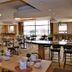 Road Lodge Bloemfontein Airport breakfast area with tables, chairs and large windows in Bloemfontein