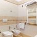 Villa Ambrosina in Impruneta bathroom with bidet, wall-mounted sink, towel warmer and shower head
