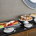 Breakfast buffet at Home2 Suites by Hilton Chicago McCormick Place in Chicago with pastries, fruit and eggs