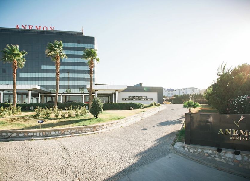 Anemon Grand Denizli Otel in Denizli with modern facade, palm trees, and landscaped driveway