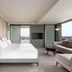 Mercure Chandigarh Tribune Chowk room with king bed, sofa, TV, and city-view windows in Chandigarh