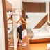 Neotel Hotel City Centre in Tanjung Redeb, compact guest room with bed, desk, wall art, and window curtain