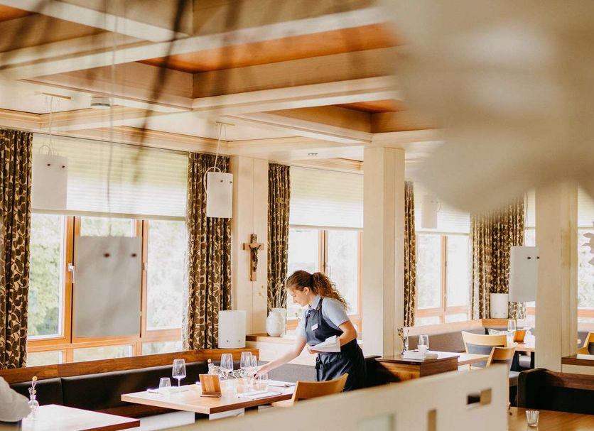 Maiers Johanniterbad Ringhotel Rottweil dining area with staff setting tables and large windows
