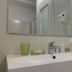 Mamma Ciccia, Mandello del Lario bathroom with sink, mirror, wall-mounted hair dryer and toiletries