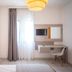 Alkinoos Beach Hotel Gerakini guest room with double bed, desk, wall TV and window light