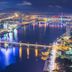 Stella Maris Beach Danang in Da Nang with panoramic nighttime river and city bridge views