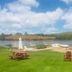 Trillium Resort & Spa in Port Sydney: lakeside beach with dock, loungers, picnic table and Adirondack chairs