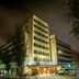 Vip Executive Picoas Hotel in Lisbon at night, street corner exterior with illuminated facade