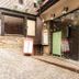 La Confiance in Le Mont-Saint-Michel, stone hotel entrance with glass door and posted menus