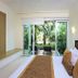 Bahia Principe Escape Sian Ka'an - Adults Only room with sliding doors to lush garden patio in Akumal