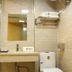 Center Of City Creo Hotel, Yanbian bathroom with glass shower, sink, mirror, toilet and towel rack