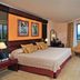 Melia Santiago De Cuba room with king bed, large window view, TV, and seating area in Santiago de Cuba
