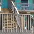 The 409 Bolivar Beach Hotel in Bolivar Peninsula with exterior stairs and turquoise balconies